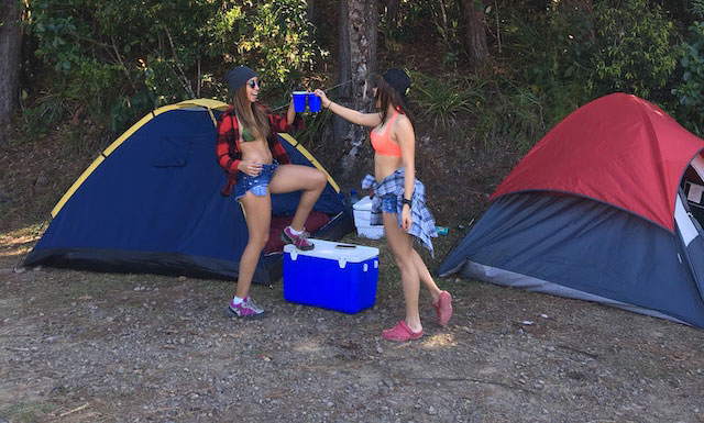 2 Girls standing around a 48 quart cooler